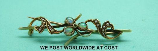 An Edwardian brooch set with opals and seed pearls,