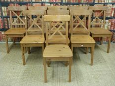 Nine pine chairs with solid seats and X shaped backs