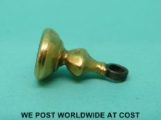 A Victorian yellow metal seal or ignot.