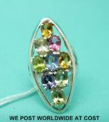 A silver ring set with multi-coloured oval cut sapphires (size N)