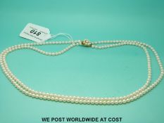 A two strand pearl necklace with 9ct gold clasp