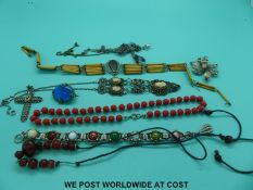 A collection of jewellery to include a butterfly wing brooch, silver cross,