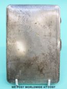 A hallmarked silver cigarette case with engine turned decoration (201g)
