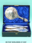 A hallmarked silver dressing table set comprising hand mirror, four brushes and comb, in fitted box,