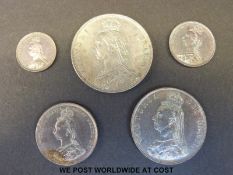 An 1887 half crown, florin, one shilling sixpence and a threepence,