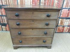 A 19thC oak chest of four graduated drawers raised on bracket feet (H96 x W104 x D56cm)