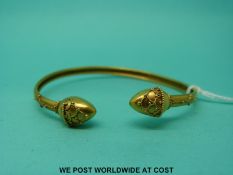 A c1880 Victorian yellow metal child's bangle in the Etruscan style