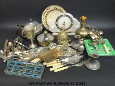 A collection of silver plate to include teapot, Viners, clock,