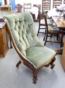 A Victorian upholstered moulded mahogany button back nursing chair raised on brass castors