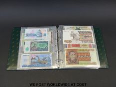 Approximately one hundred world banknotes in an album