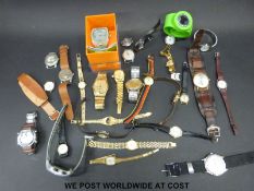 A collection of various vintage mechanical and other wristwatches, some in original boxes.