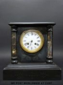 A black slate mantel clock with 'Benson, Ludgate Hill' to face,