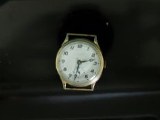 A 9ct gold gentleman's wristwatch with subsidiary seconds dial and Arabic numerals,