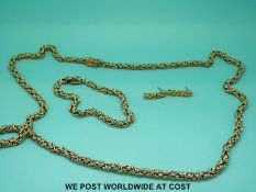 A suite of 9ct gold jewellery comprising necklace, bracelet and earrings,