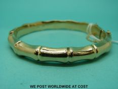 A 9ct gold bangle of bamboo style (11.