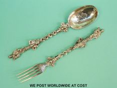 A Victorian hallmarked silver apostle spoon and fork, London 1850, maker's mark CTF, length 15.
