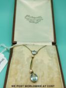 An Edwardian 15ct gold necklace set with seed pearls and aquamarines,