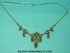 An Edwardian necklace marked 15ct,