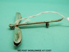 A silver brooch in the form of a dragonfly