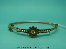 A Victorian bangle set with seed pearls (4.