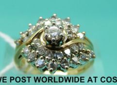 A yellow metal ring marked 14k set with diamonds which separates into two rings (size K)