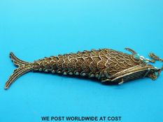 A silver gilt vesta in the form of a fish in filigree with turquoise eyes,