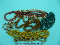 A collection of beaded necklaces to include malachite, two carnelian agate, another agate example,