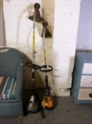 Two petrol strimmers.