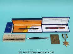 A Conway Stewart fountain pen with 14ct gold nib, a Sheaffer pen, two Waterman pens,