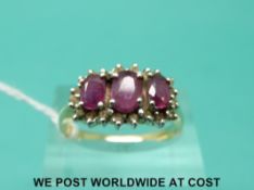 A 14ct gold ring set with rubies and diamonds (size P)