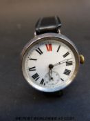 A hallmarked silver gentleman's wristwatch with skeleton hands, Roman numerals,