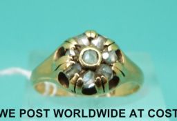 An 18ct gold ring set with rose cut diamonds in a flower cluster (size O)