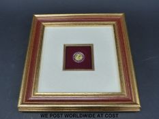 A framed Charles IV Czechoslovakian 1/10 oz gold coin commemorating the foundation of Karlstejn