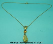 A yellow metal necklace marked 9ct gold set with pear cut,