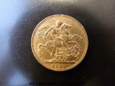 An 1893 gold full sovereign veiled head
