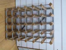 A 24 bottle wooden and metal wine rack.