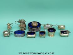 Twelve various hallmarked silver cruets, mustards etc to include blue glass lined examples, tankard,