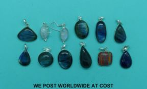 Nine silver pendants set with labradorite,