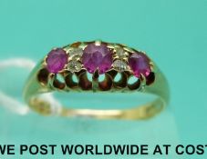 An Edwardian 18ct gold ring set with diamonds and rubies (size N)
