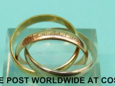 A Les Must de Cartier Russian tricolour wedding band marked 750 (7.