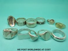 Eleven large gentleman's rings including signet rings etc