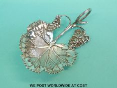 A William IV hallmarked silver vine leaf caddy spoon,