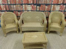 A wicker effect suite of conservatory furniture with cushions