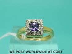 An 18ct gold ring set with an amethyst surrounded by diamonds in a square setting (size L)