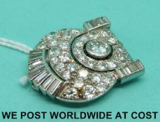 An 18ct white gold Art Deco clip set with round brilliant cut and baguette cut diamonds,