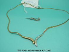 A 9ct gold bi-coloured necklace set with diamonds and an odd 9ct gold earring