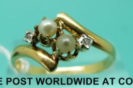 A French yellow metal ring set with pearls and diamonds (size Q)