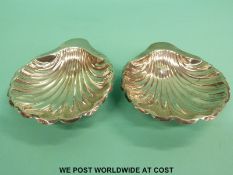 A pair of hallmarked silver shell-shaped dishes,