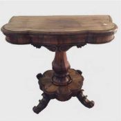 A William IV rosewood tea table, on shaped column support and inverted scroll feet, width 94 cm.