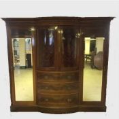 A Georgian mahogany bow fronted compactum wardrobe,